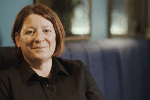Mel, Hotel Indigo employee, smiles to camera.