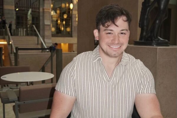 An image of Nathan smiling to camera.